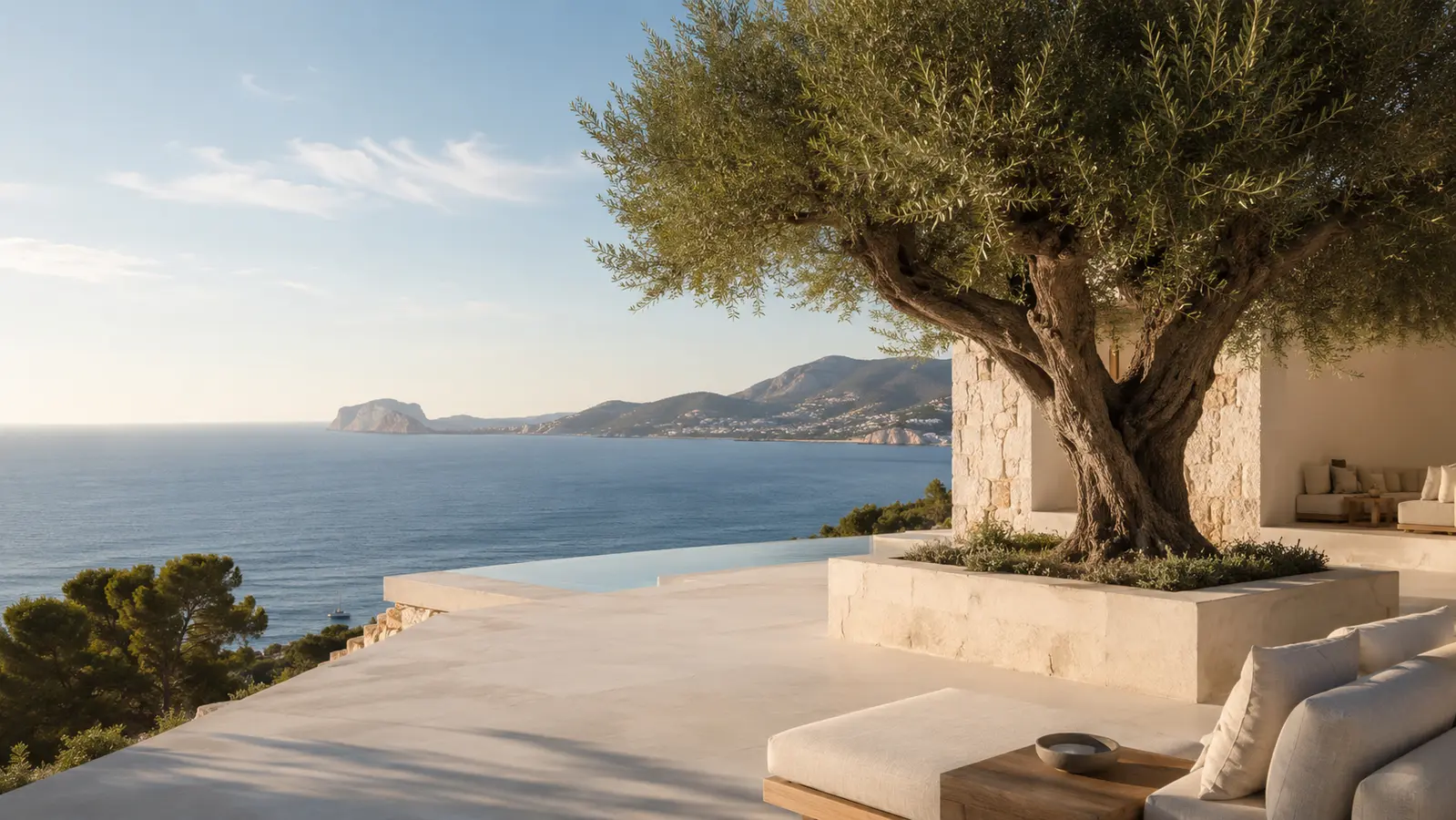 Mediterranean villa terrace with an olive tree looking out across the Costa Blanca sea.